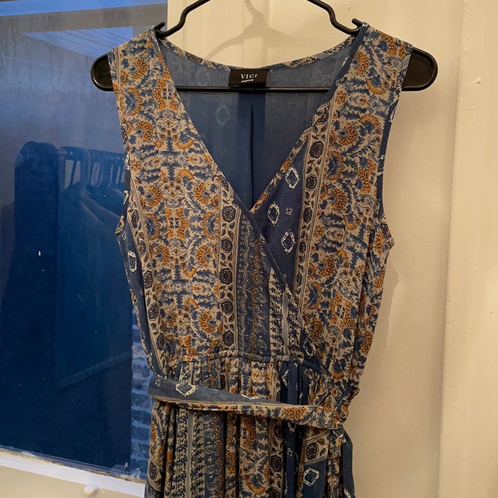Blue and yellow maxi dress. V-neck with closure. Size medium.